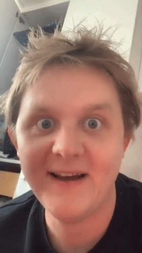 A Close Up Of A Man Making A Funny Face With His Mouth Open GIF