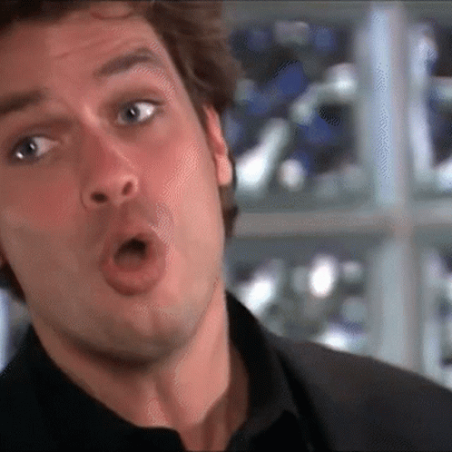 A Close Up Of A Man Making A Funny Face With His Mouth Open GIF
