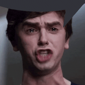 A Close Up Of A Man Making A Funny Face With His Mouth Open GIF
