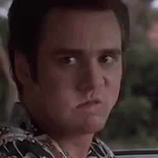 A Close Up Of A Man Making A Surprised Face While Sitting In A Car . GIF