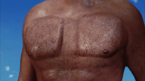 A Close Up Of A Man 'S Chest With Hair On It GIF