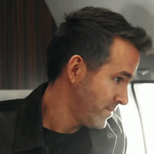 A Close Up Of A Man 'S Ear And Neck GIF