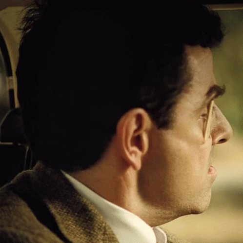 A Close Up Of A Man 'S Ear And Nose In A Car GIF