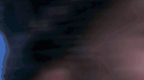A Close Up Of A Man 'S Eye With A Blue Pupil GIF
