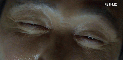 A Close Up Of A Man 'S Eyes With Netflix Written On The Bottom Right GIF