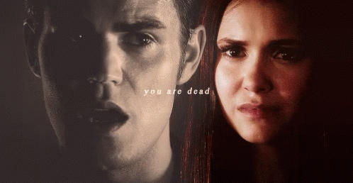 A Close Up Of A Man 'S Face And A Woman 'S Face With The Words You Are Dead Above Them GIF