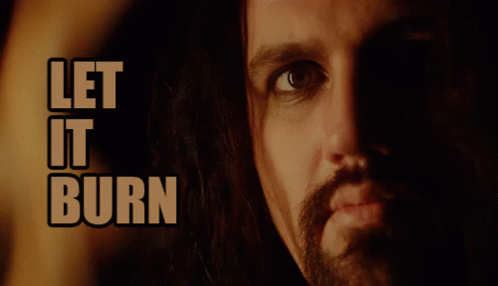 A Close Up Of A Man 'S Face And The Words Let It Burn GIF