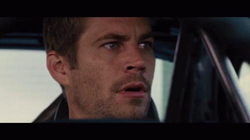 A Close Up Of A Man 'S Face In A Car With A Surprised Look On His Face GIF