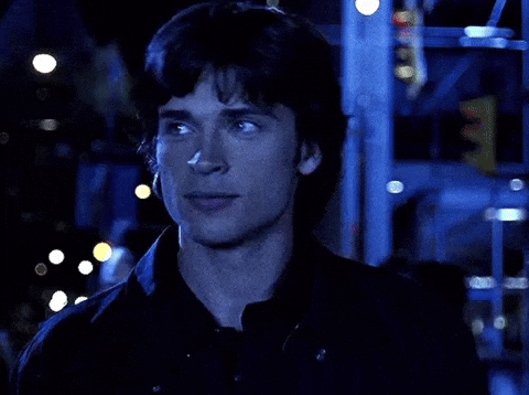 A Close Up Of A Man 'S Face In A Dark Room GIF
