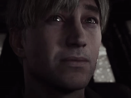a close up of a man 's face in a dark room .