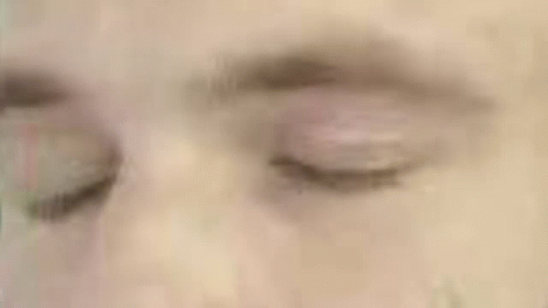 a close up of a man 's face in a green circle