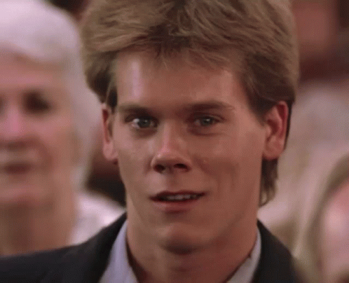 A Close Up Of A Man 'S Face In A Suit GIF