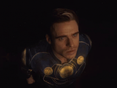 A Close Up Of A Man 'S Face In A Superhero Costume GIF