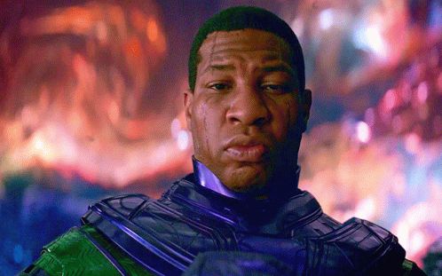 A Close Up Of A Man 'S Face In Front Of A Fire GIF