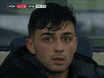 a close up of a man 's face in front of a scoreboard that says fcb 4 3 atm 85:28