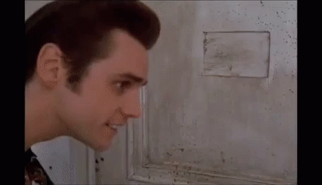 A Close Up Of A Man 'S Face Looking At The Camera . GIF