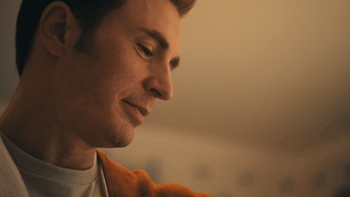 A Close Up Of A Man 'S Face Looking Down GIF