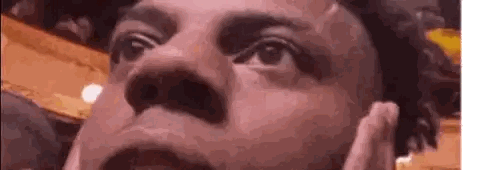 a close up of a man 's face looking up