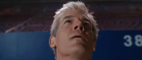 a close up of a man 's face looking up .