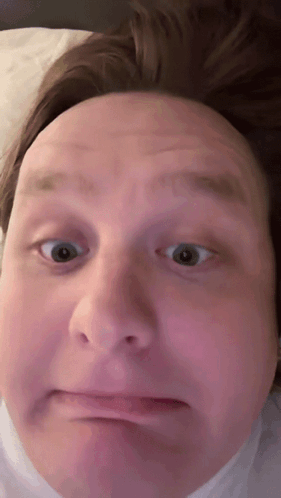 A Close Up Of A Man 'S Face Making A Face GIF
