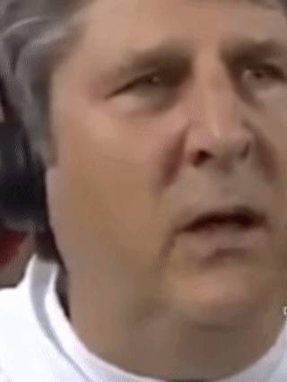 A Close Up Of A Man 'S Face Making A Funny Face . GIF