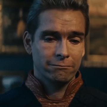 A Close Up Of A Man 'S Face Making A Funny Face . GIF