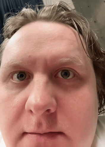 A Close Up Of A Man 'S Face Shows His Eyes GIF