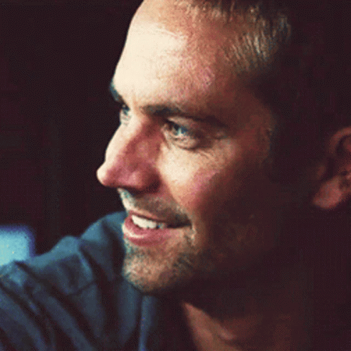 A Close Up Of A Man 'S Face Smiling GIF