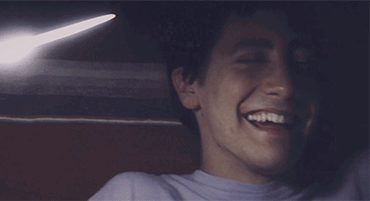 A Close Up Of A Man 'S Face Smiling GIF