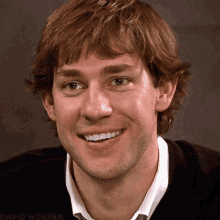A Close Up Of A Man 'S Face Smiling With The Name David Worren In The Corner GIF