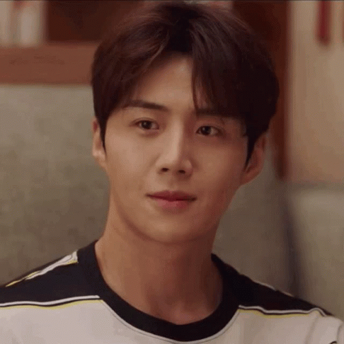A Close Up Of A Man 'S Face Wearing A Striped T-Shirt . GIF