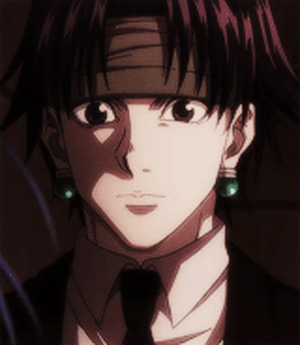 A Close Up Of A Man 'S Face Wearing A Suit And Tie GIF