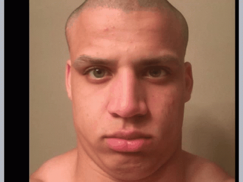 A Close Up Of A Man 'S Face With A Bald Head GIF