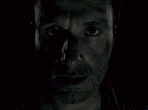 A Close Up Of A Man 'S Face With A Beard And A Black Eye . GIF