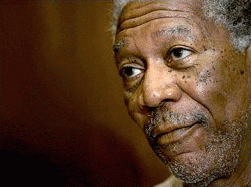 A Close Up Of A Man 'S Face With A Beard And A Serious Look On His Face . GIF
