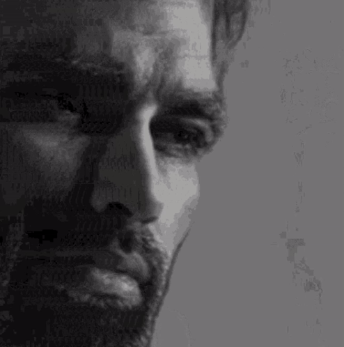 A Close Up Of A Man 'S Face With A Beard And Mustache . GIF