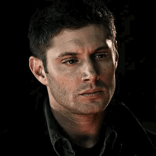 A Close Up Of A Man 'S Face With A Beard Looking At The Camera . GIF