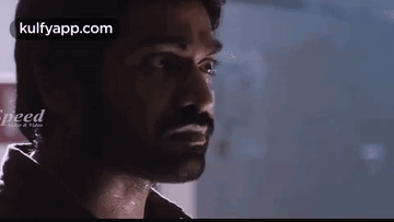 A Close Up Of A Man 'S Face With A Beard Looking At The Camera . GIF