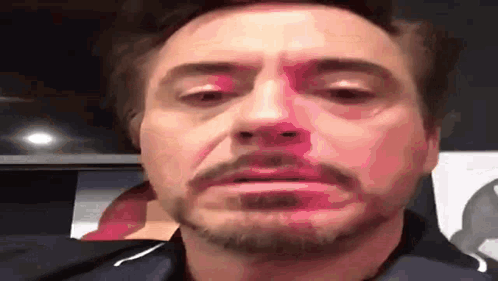 A Close Up Of A Man 'S Face With A Beard Making A Face . GIF