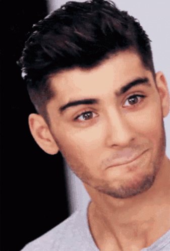 A Close Up Of A Man 'S Face With A Beard Making A Funny Face GIF