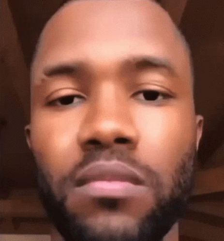 A Close Up Of A Man 'S Face With A Beard Making A Funny Face . GIF