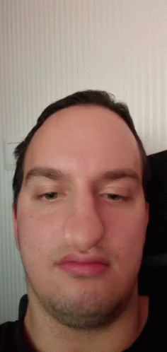A Close Up Of A Man 'S Face With A Beard GIF