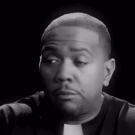 A Close Up Of A Man 'S Face With A Black Background GIF