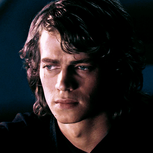 A Close Up Of A Man 'S Face With A Black Shirt GIF