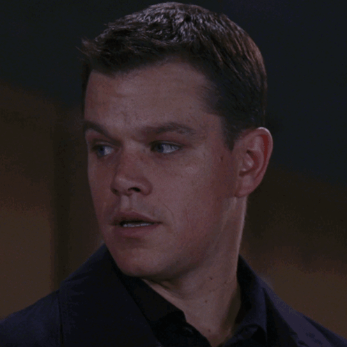 A Close Up Of A Man 'S Face With A Black Shirt GIF