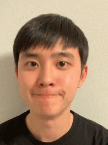 A Close Up Of A Man 'S Face With A Black Shirt On GIF