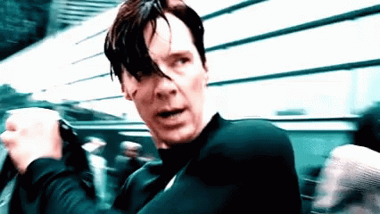A Close Up Of A Man 'S Face With A Black Shirt On GIF