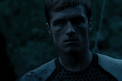 A Close Up Of A Man 'S Face With A Blue Background GIF