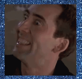 A Close Up Of A Man 'S Face With A Blue Glitter Background GIF