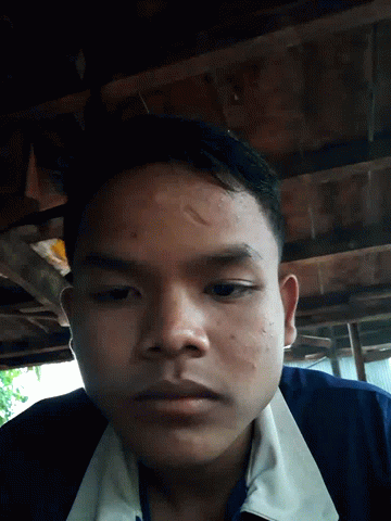 Close Up Of Man's Face In Blue Shirt GIF